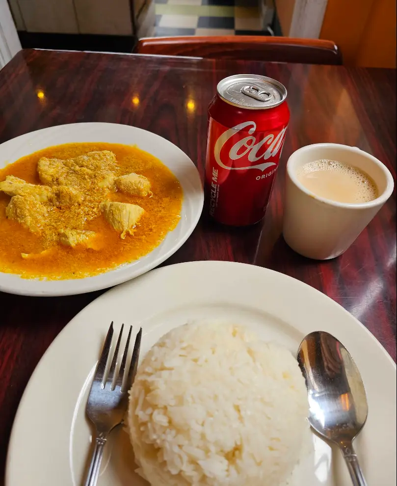 Chicken curry with rice, chai and Coke at Tibet Kitchen restaurant in Boulder CO
