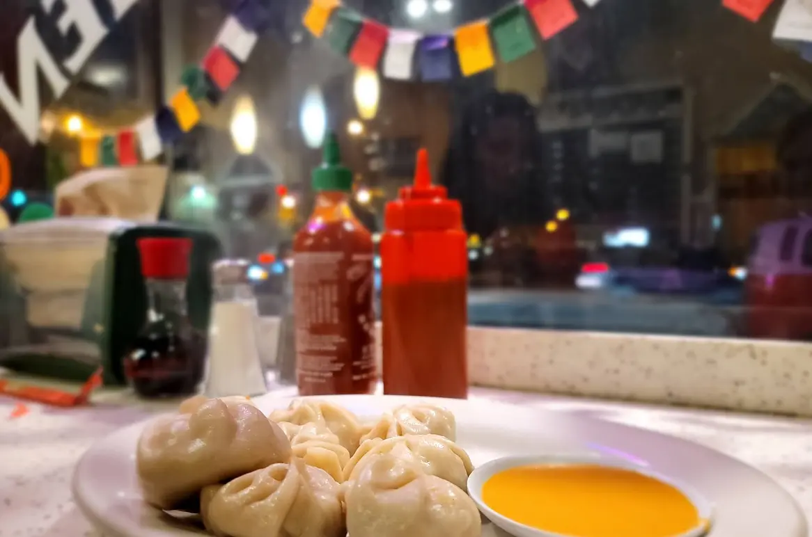 Steamed Tibetan momos with dipping sauce at Tibet Kitchen, 2359 Arapahoe Ave, Boulder CO